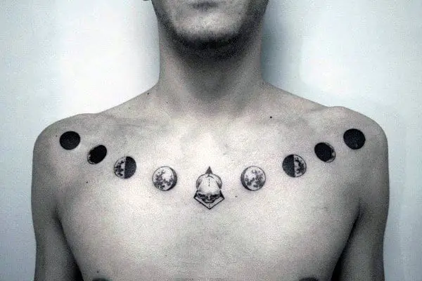 chest-and-shoulder-moon-phases-skull-mens-chest-tattoo