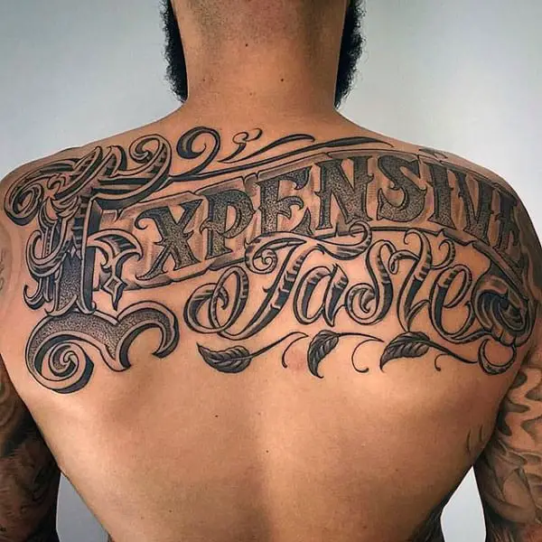 expensive-taste-mens-words-upper-back-tattoo-ideas