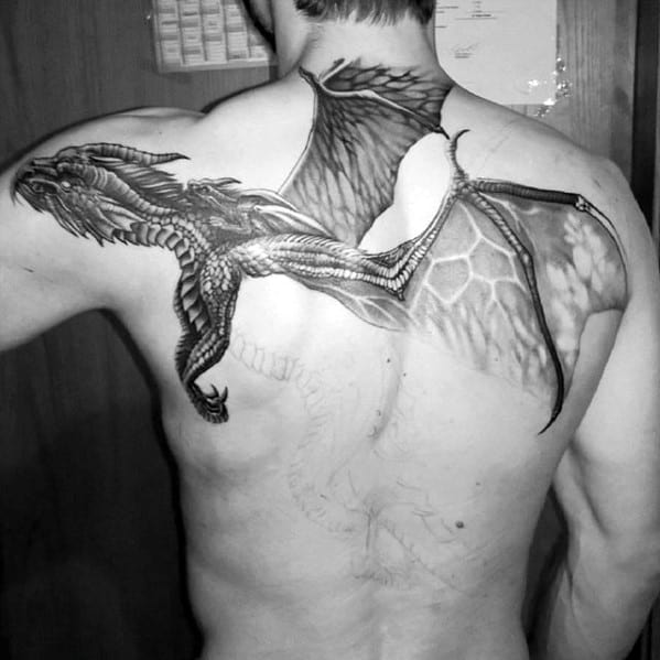 flying-dragon-wings-guys-upper-back-and-shoulder-tattoo