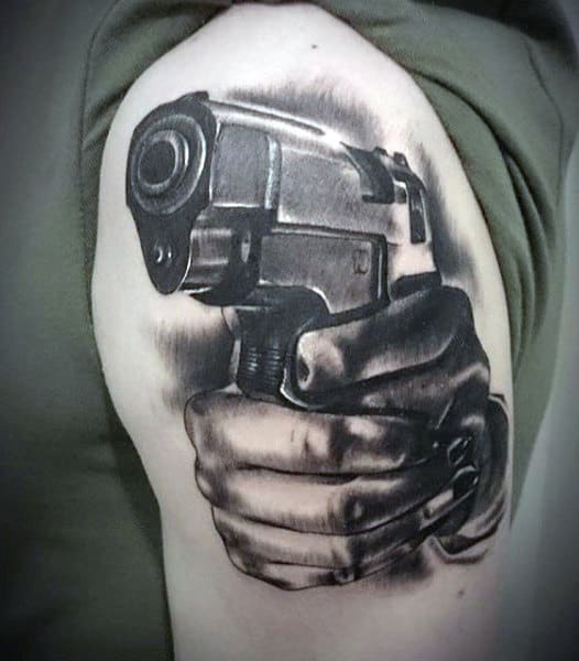 hands-with-firearm-male-gangster-upper-arm-tattoos