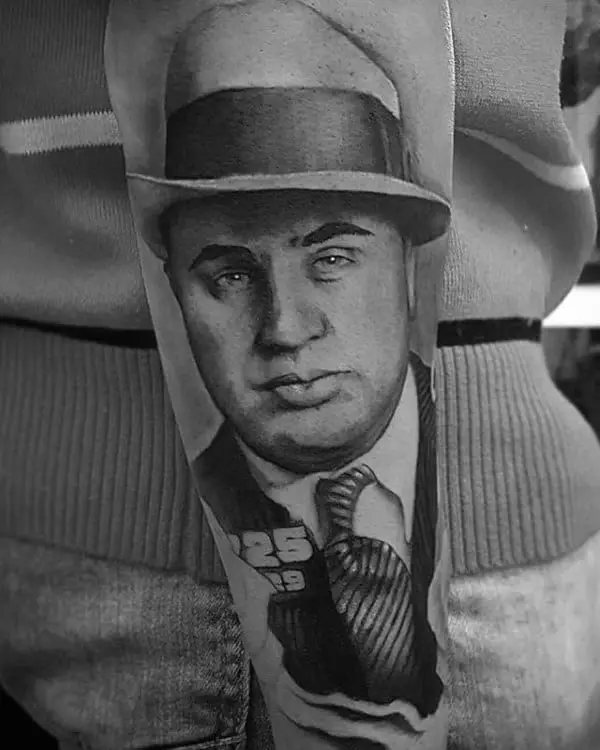 man-with-gangster-outer-forearm-portrait-tattoo
