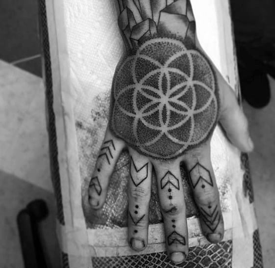 flower-of-life-negative-space-dotwork-creative-geometric-hand-tattoos-for-men