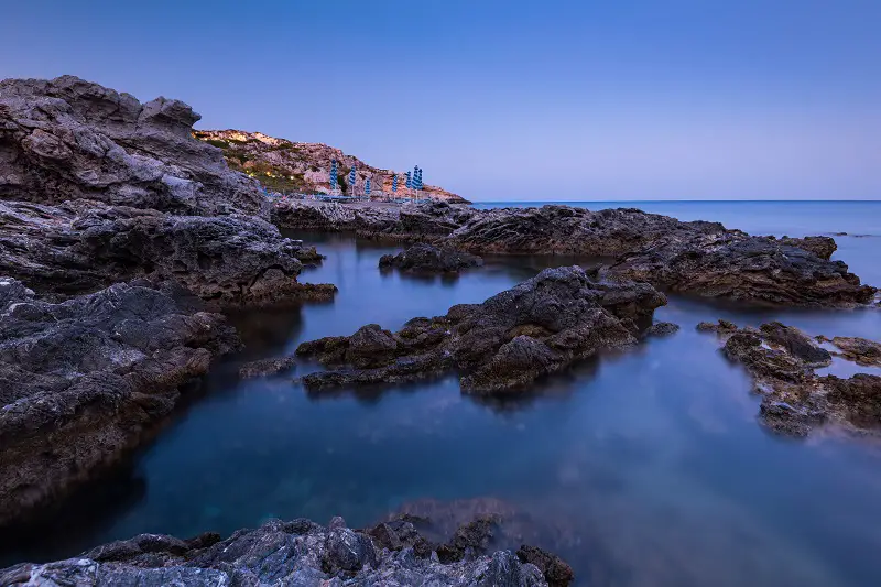 Twilight Over Rocky Beach and Cliffs at Rhodes Island,Greece