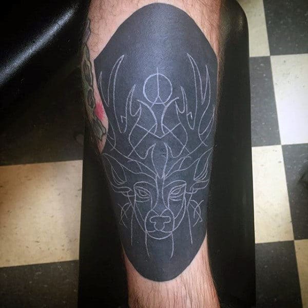 abstract-deer-tattoo-with-white-ink-over-black-for-guys-on-leg