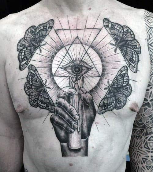 all-seeing-eye-moths-around-lit-candle-mens-chest-tattoos
