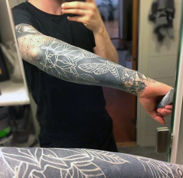 Gareth Doye Tattoos White ink and blackout in progress by