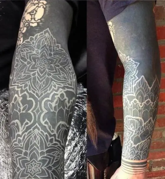 awesome-blackwork-white-ink-sleeve-tattoo-on-man