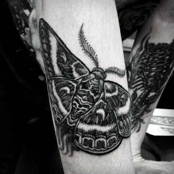 black-ink-dotwork-guys-moth-outer-forearm-tattoo