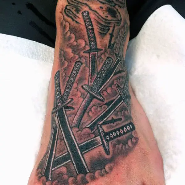 cool-guys-white-ink-foot-tattoo-of-swords-in-clouds