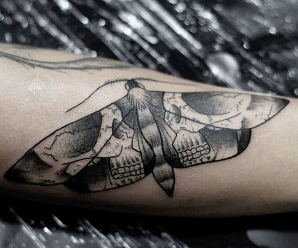 double-skulls-mens-moth-forearm-tattoo
