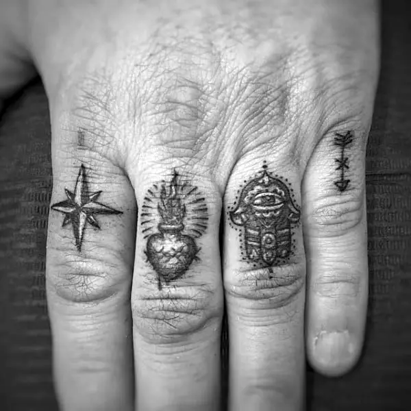 four-symbols-on-mans-hand-finger-tattoos