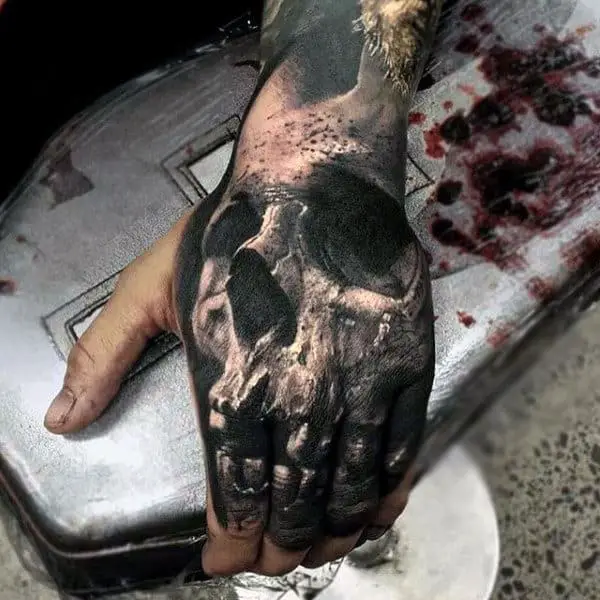 full-3d-skull-hand-and-finger-tattoo-for-men-in-black-ink
