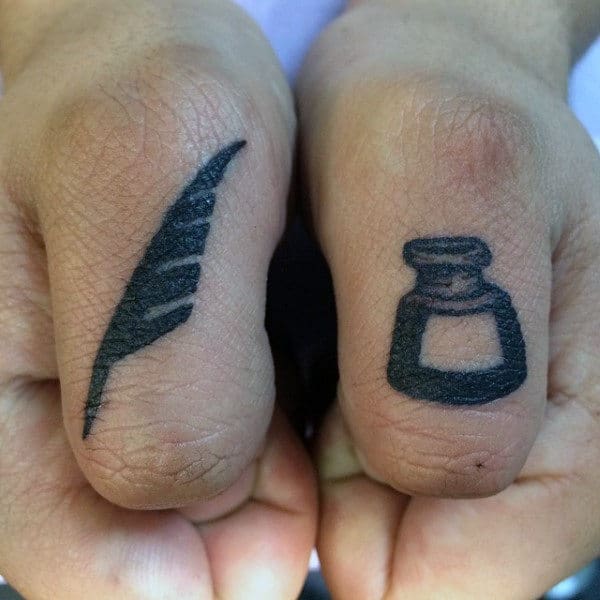 gentleman-with-thumb-tattoo-of-pen-and-ink-bottle