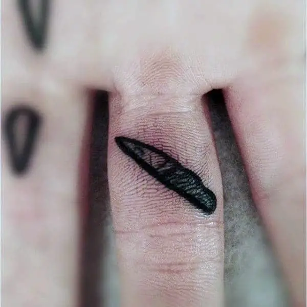 guys-inside-finger-tattoo-of-tiny-knife-design