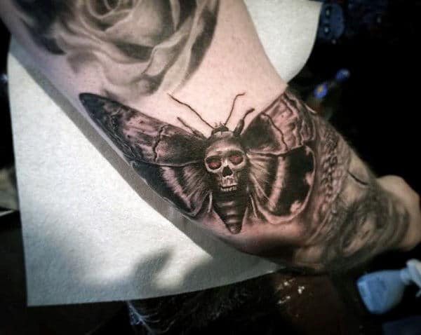 outer-arm-masculine-moth-tattoo-on-male