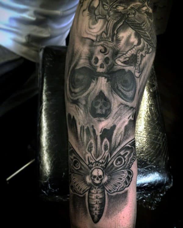 skull-moth-tattoo-on-gentleman-forearm-sleeve-design