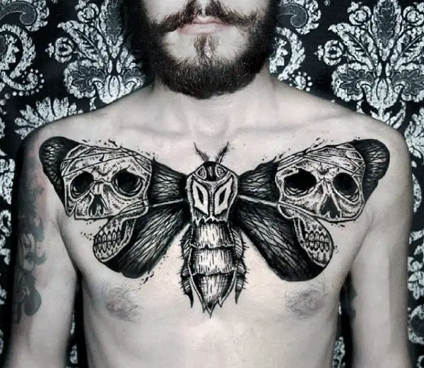 skulls-moth-wings-mens-upper-chest-tattoos