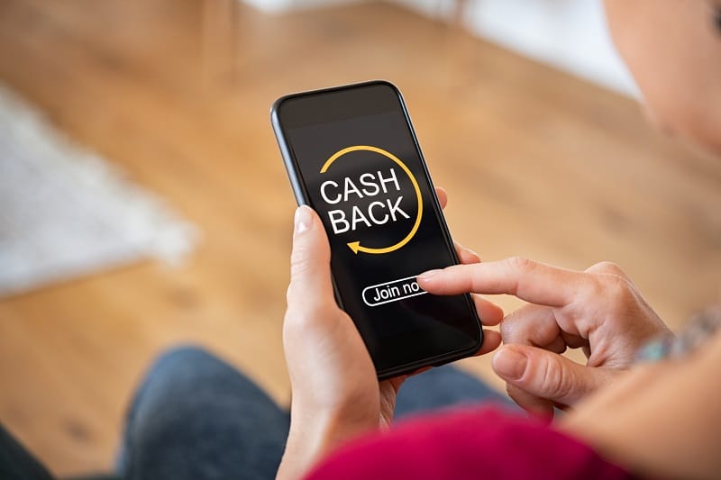 Woman using cashback app on phone