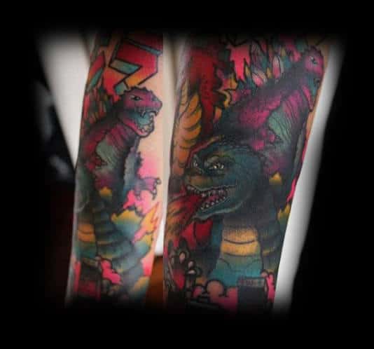 cool-cartoon-like-godzilla-tattoo-lots-of-color-on-guy