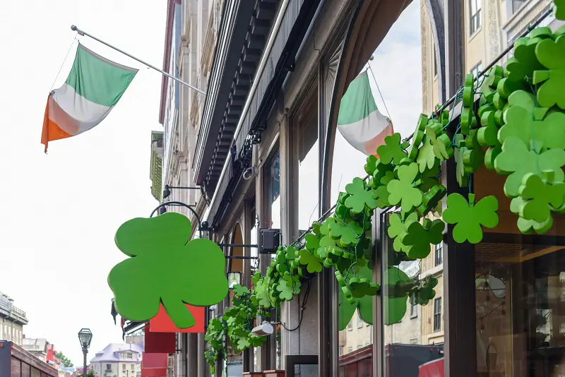 exterior of irish pub decorated with shamrocks for St Patricks D