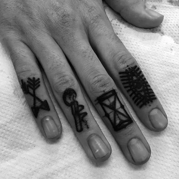 gentleman-with-small-arrow-tattoo-on-fingers