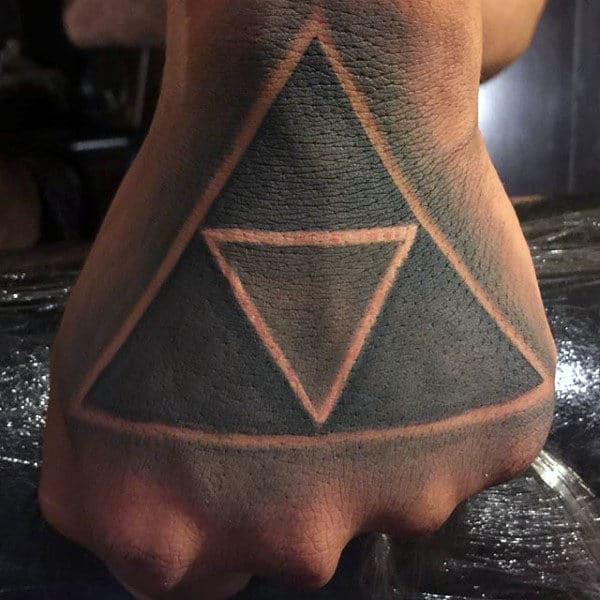 guy-with-black-ink-negative-space-legend-of-zelda-triforce-hand-tatoo