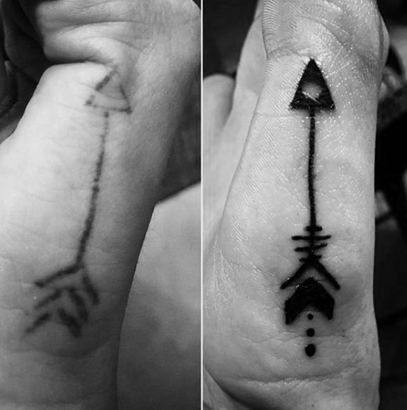 guy-with-small-arrow-tattoo-design-side-of-hand