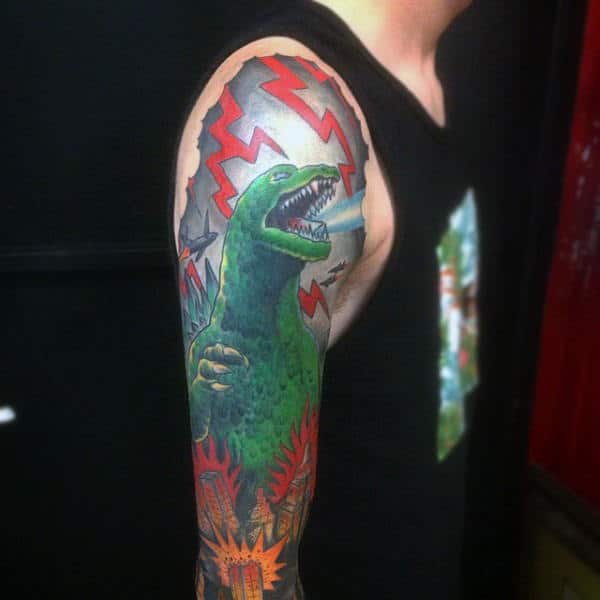 illustrative-scene-of-godzilla-in-storm-sleeve-tattoo-on-man