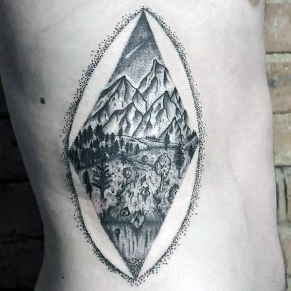 rib-cage-side-artistic-male-mountains-with-river-tattoo-ideas