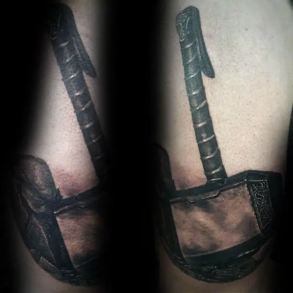 3d-realistic-tattoo-of-mjolnir-on-mans-arm