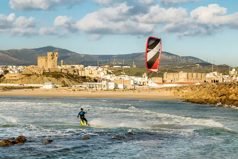 Man,Practicing,Kitesurfing,On,The,Beach,Of,Tarifa,,Spain.,Tarifa