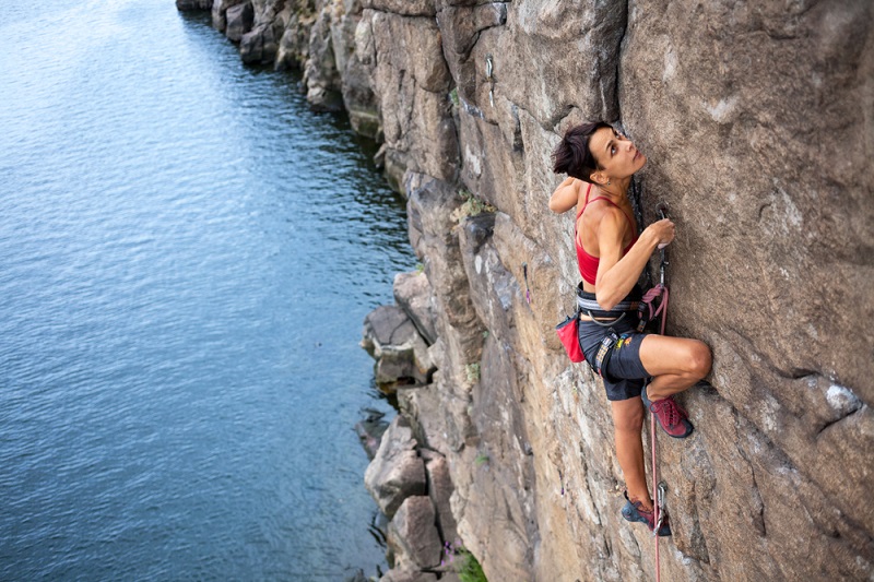 The,Girl,Climbs,A,Climbing,Route,Over,The,Water.,Extreme