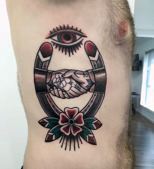 all-seeing-eye-handshake-horseshoe-mens-rib-cage-side-tattoos