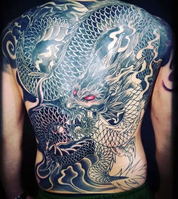 awesome-dragon-with-red-eyes-male-back-tattoo