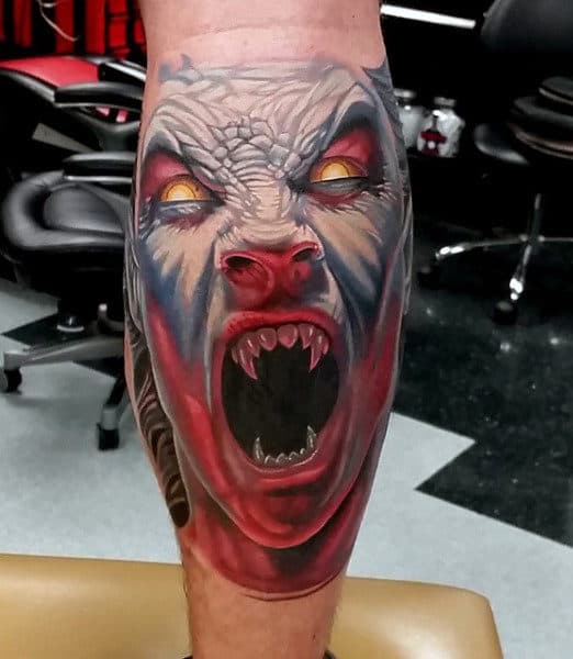 back-of-leg-calf-guys-vampire-fangs-tattoo