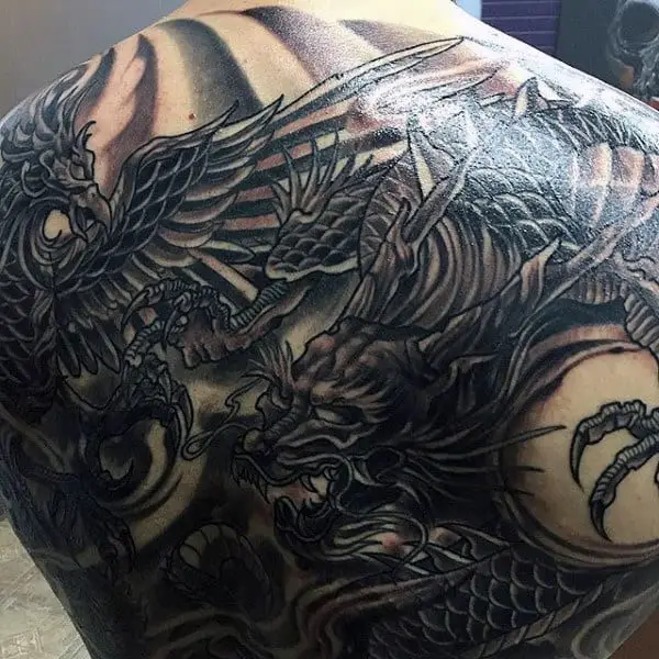black-and-grey-dark-male-dragon-back-tatoto-inspiration