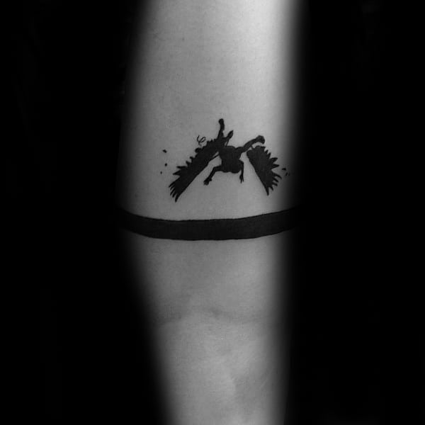 black-ink-small-simple-mens-icarus-tattoo-on-inner-forearm
