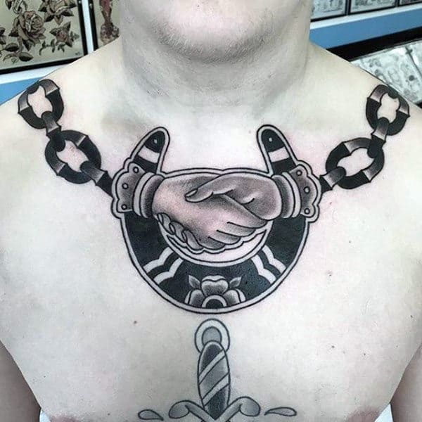 chain-horseshoe-handshake-mens-upper-chest-tattoos
