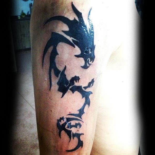 cool-arm-black-tribal-dragon-male-tattoos