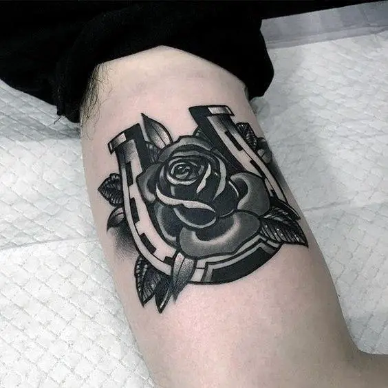 cool-shaded-black-and-grey-horseshoe-with-rose-flower-mens-arm-tattoos