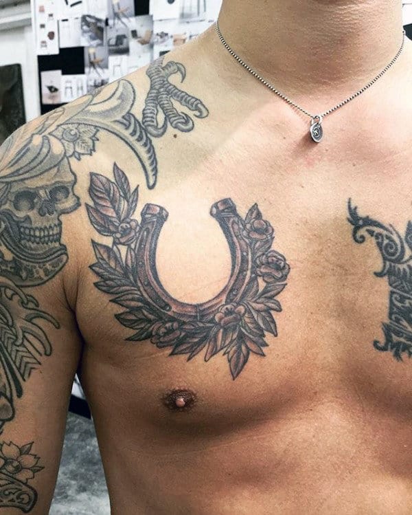 floral-chest-horseshoe-mens-tattoo