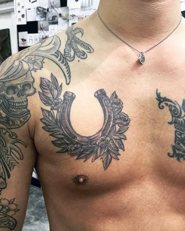 floral-chest-horseshoe-mens-tattoo