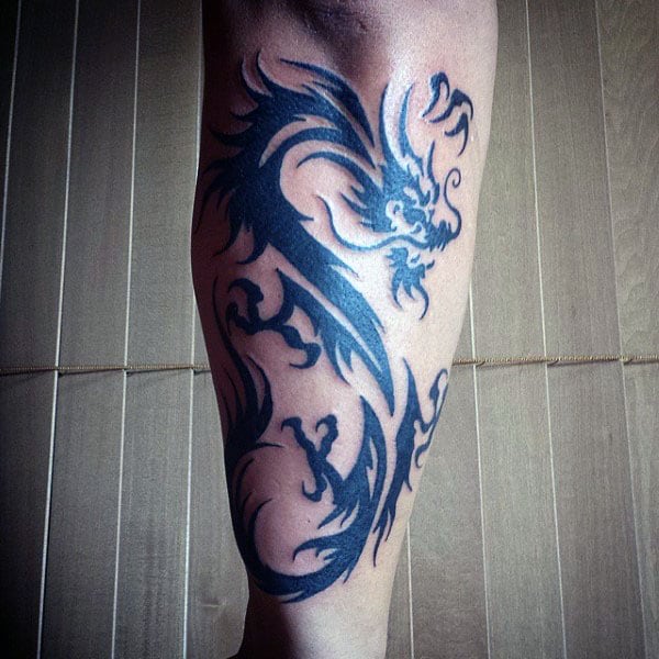 forearm-tribal-dragons-tattoos-on-guys