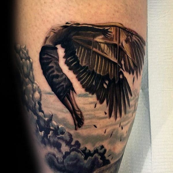 gentleman-with-black-icarus-in-clouds-arm-tattoo
