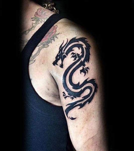 gentleman-with-tribal-dragon-arm-tattoo
