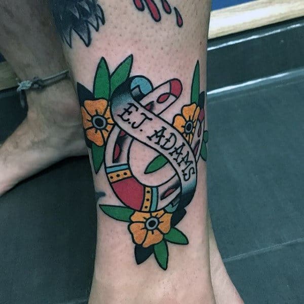 guys-memorial-horseshoe-lower-leg-tattoo-with-traditional-design