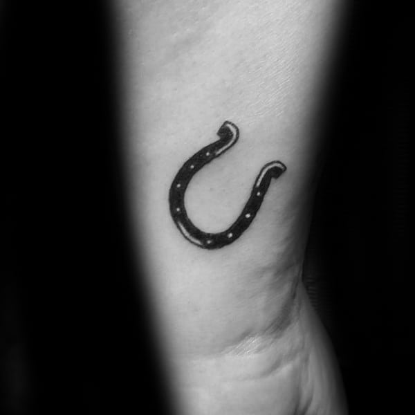 guys-tiny-horseshoe-black-ink-wrist-tattoo-design-ideas