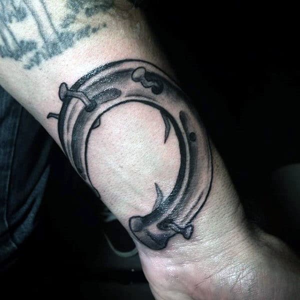 horseshoe-with-twisted-nails-mens-wrist-tattoos