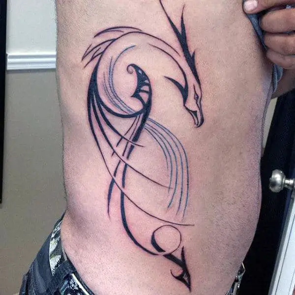 male-with-rib-cage-outline-tribal-dragon-tattoo