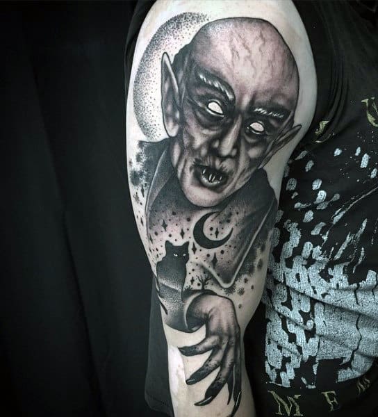 vampire-moon-and-stars-mens-upper-arm-tattoos